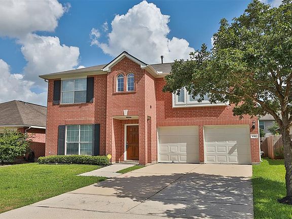 Double wide driveway to 2 car garage. In ground sprinklers too!