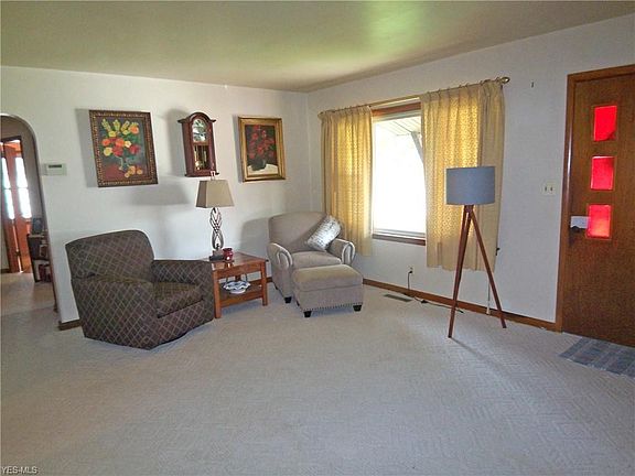 Living room offers a large picture window with good natural lighting.
