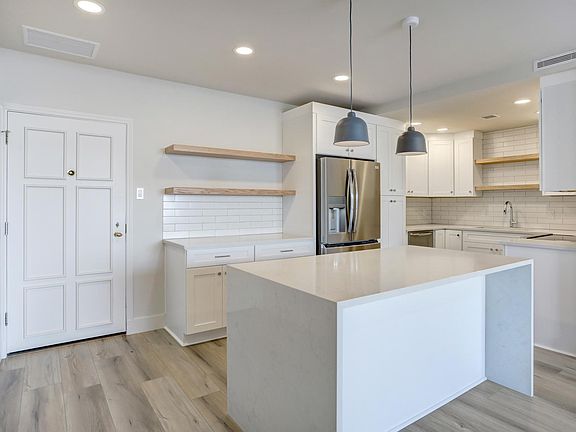 Coat closet with barn door to your left. Wood floors throughout. All new appliances.