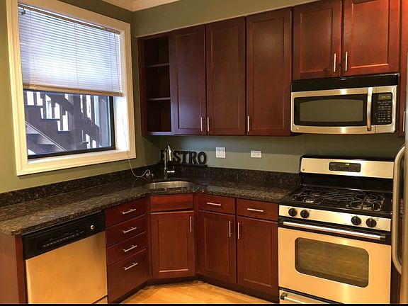 Kitchen with Stainless Steel Appliances including dishwasher and Microwave