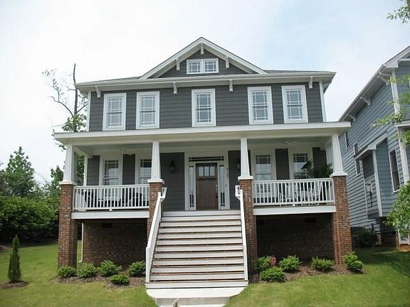 Well landscaped and welcoming porch!