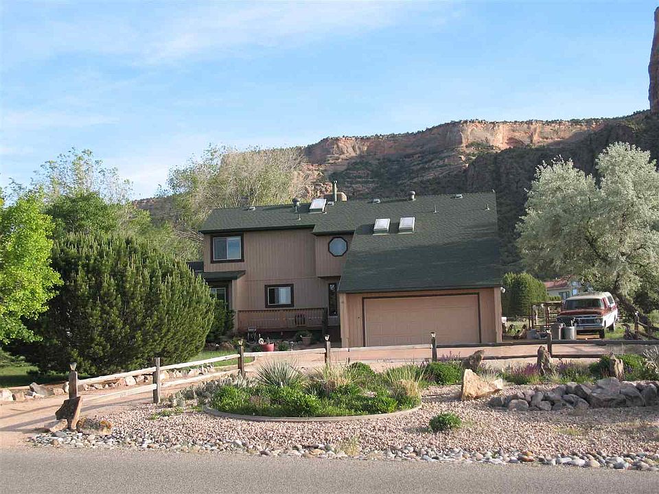 This large Redlands home backs to the Colorado National Monument and offers stun