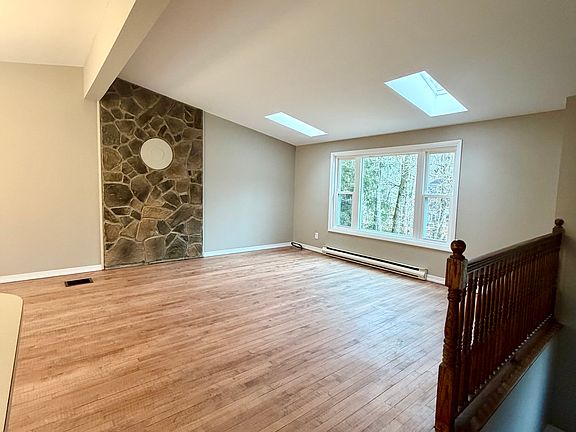 Living Room with New windows and skylights allow abundant sunlight