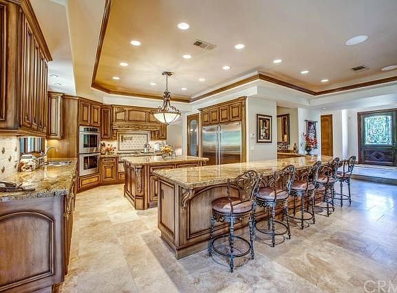 Custom kitchen with granite counters and wet bar