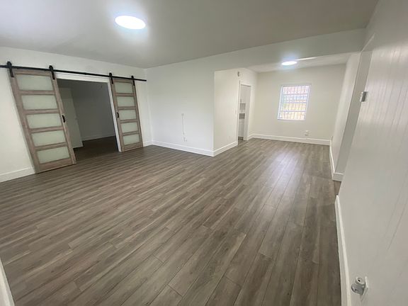 Living & Dining areas, 3rd bedroom (barn door)