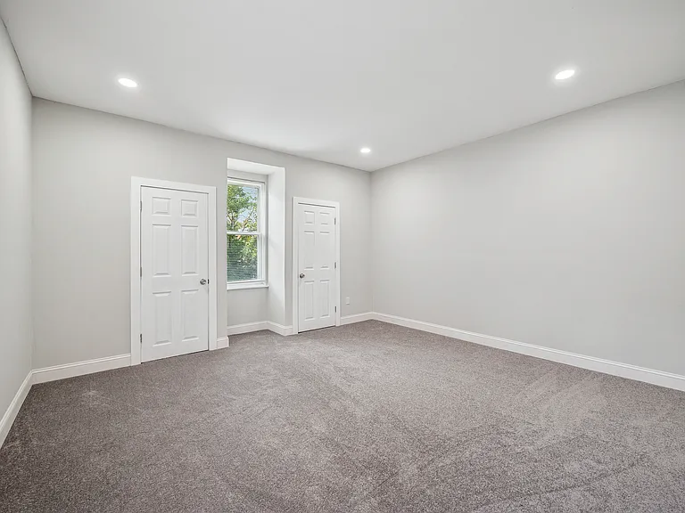 Oversized bedroom with fresh new carpets and double closets