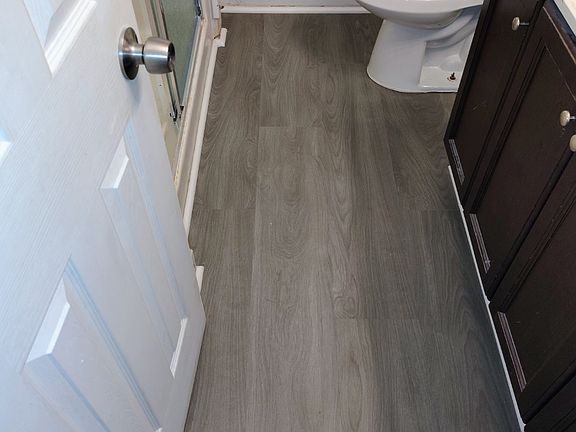 Redone Bathroom with new subfloor and flooring