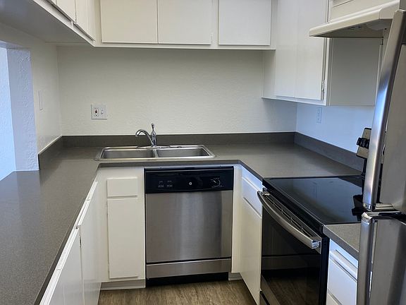 Kitchen with newer appliances.