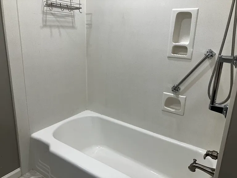 Bath with safety bars for Bedrooms One and Two.