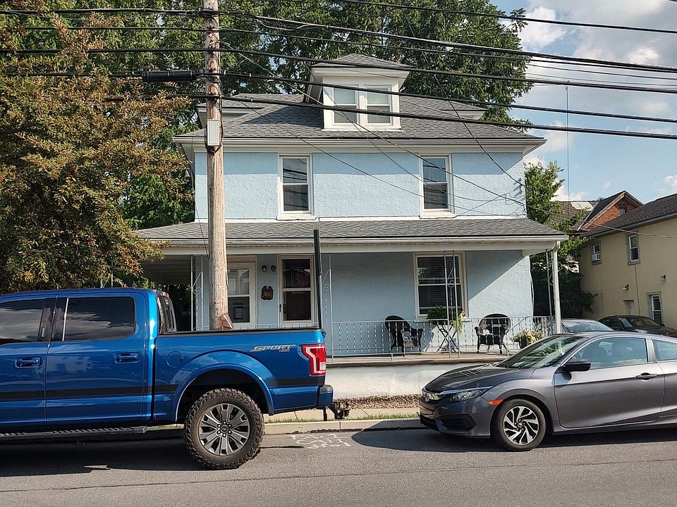 Front view (showing the on-street parking). Apartment is the 2nd and 3rd floor. Front porch is shared.