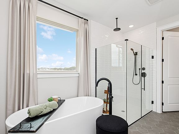 Primary bath freestanding tub and glass shower enclosure