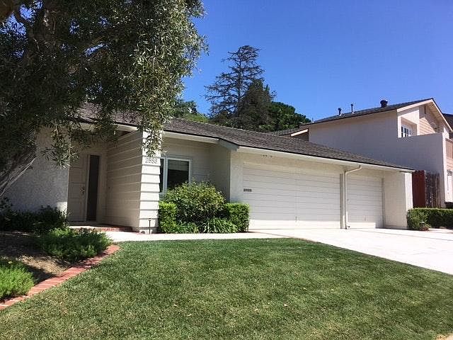 front yard with 3 car garage