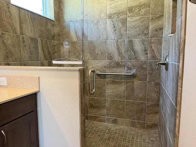 Bathroom with dual vanity and large shower