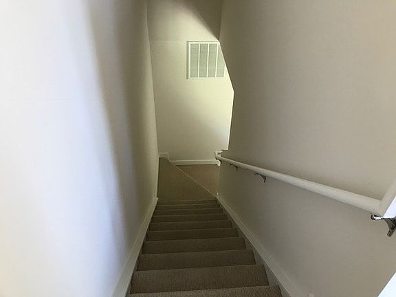 Stairwell leading to bedroom and bathroom