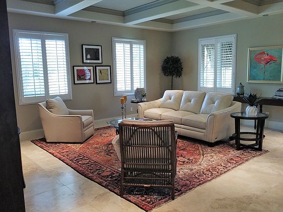 Notice the travertine floor