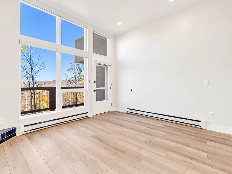 Living room with gas fireplace and walk out to back deck.