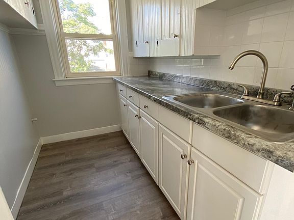 Kitchenette with tall cabinetry.