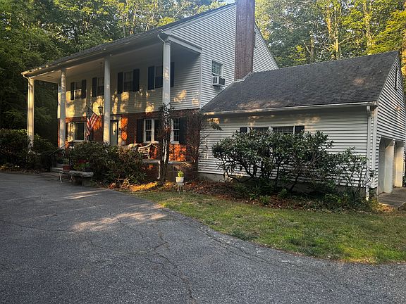 Circular driveway in front of home. Spacious garage.