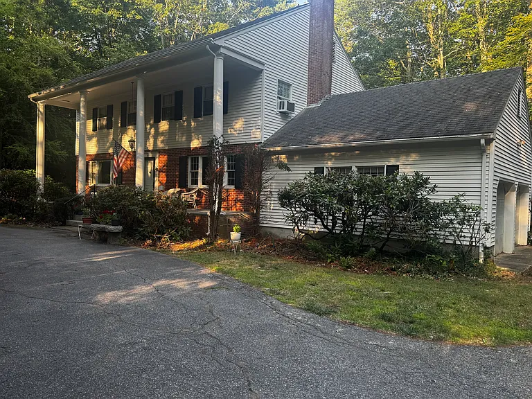 Circular driveway in front of home. Spacious garage.