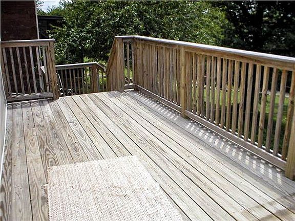 large deck overlooking the back yard