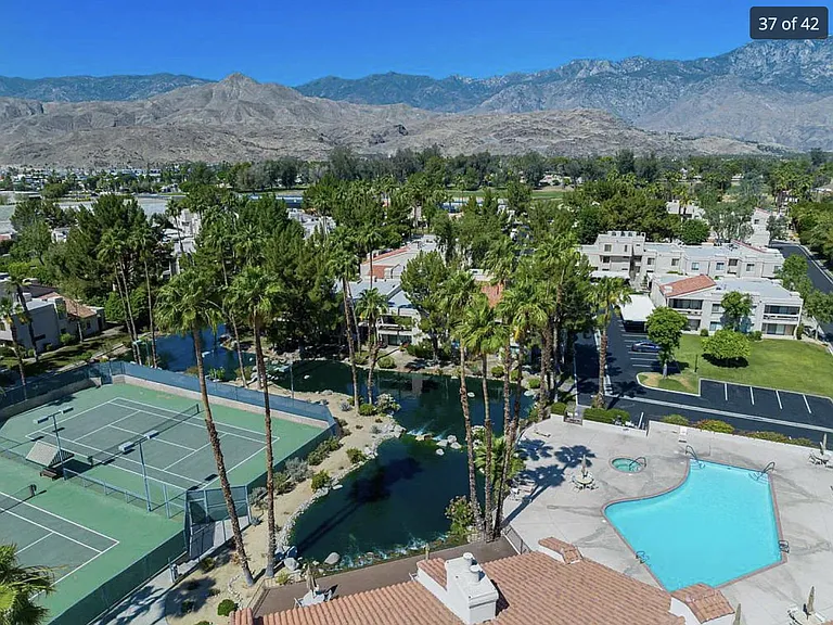 Aerial view of main pool and tennis courts