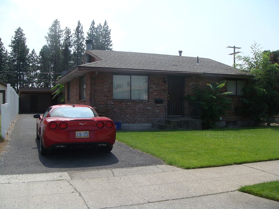 Street view; paved driveway to carport parking in the rear. 6 foot vinyl fence along driveway for added privacy.