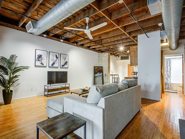 Renovated Lofts with exposed steel beams and brick accents