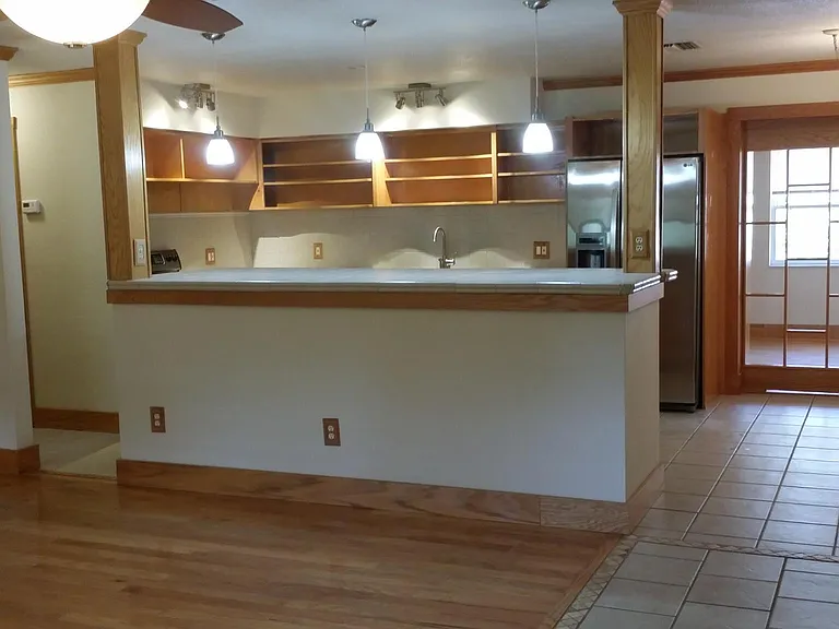 Main living area facing open kitchen