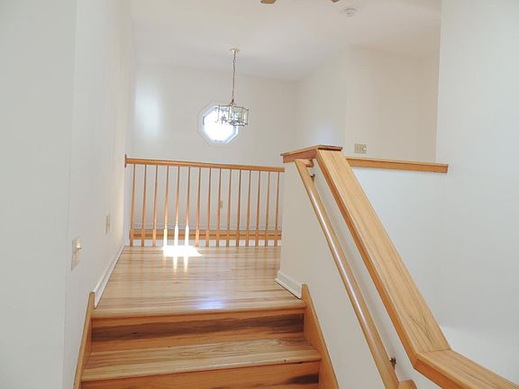 Top landing of staircase leading to two bedrooms