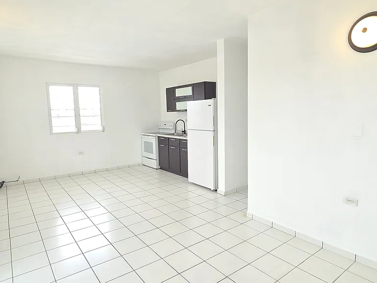 Similar angle/view of kitchen and dining area.