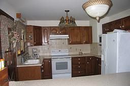 Kitchen has Oak Cabinets 