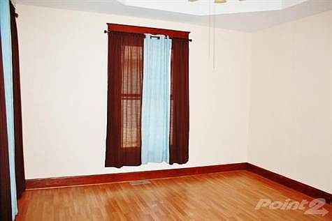 Large Living area features laminate flooring to reduce scratching.