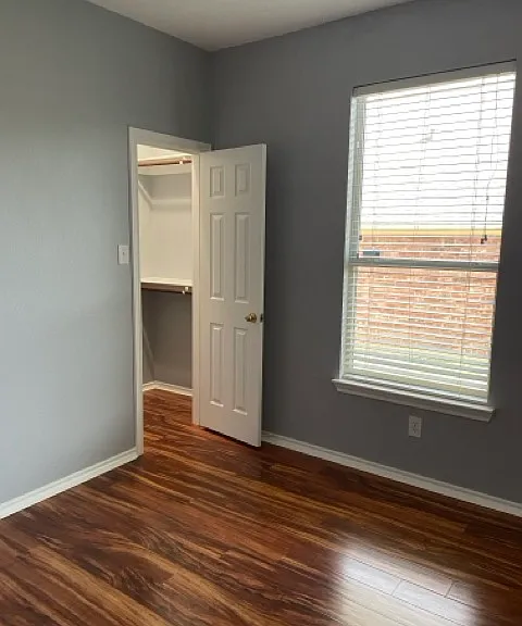 3rd bedroom closet with built in shelving.