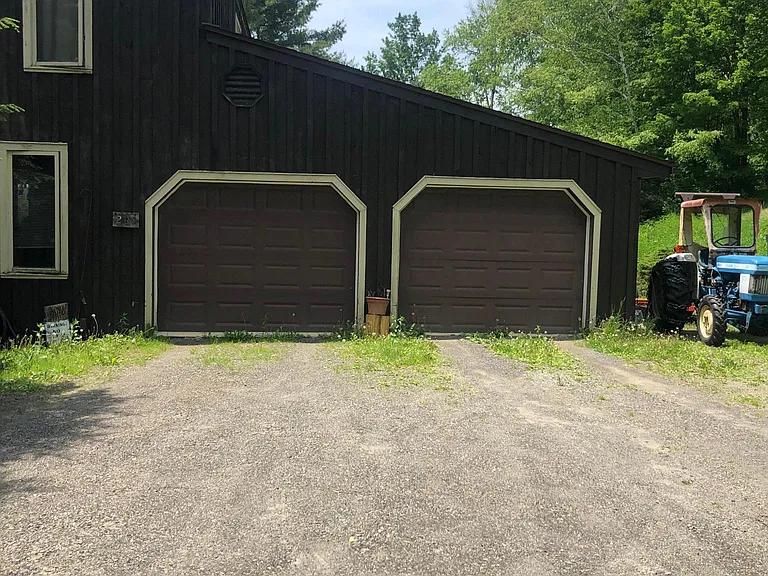 Garage bay on the right is for the tenant