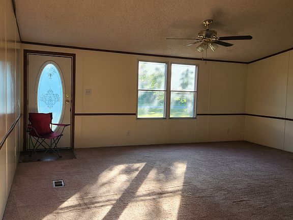 Open area Living Room across from Kitchen.