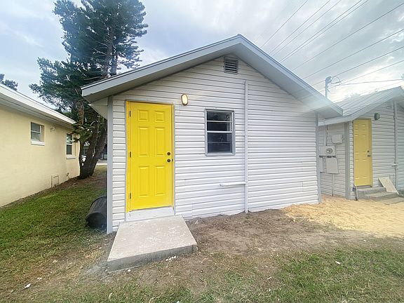 Rear entrance with open parking
