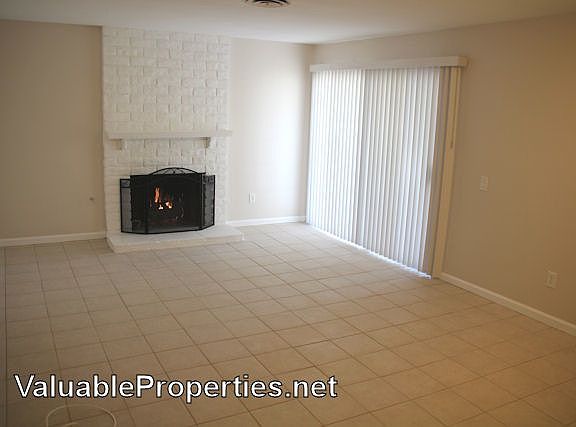 Tiled living room with gas log fireplace