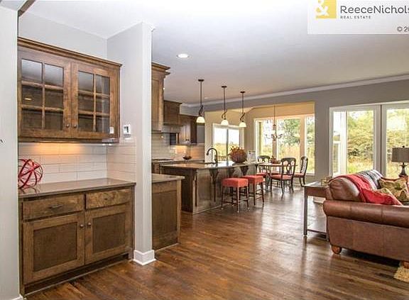 VIEW FROM DOOR INTO KITCHEN OPEN TO GREAT ROOM