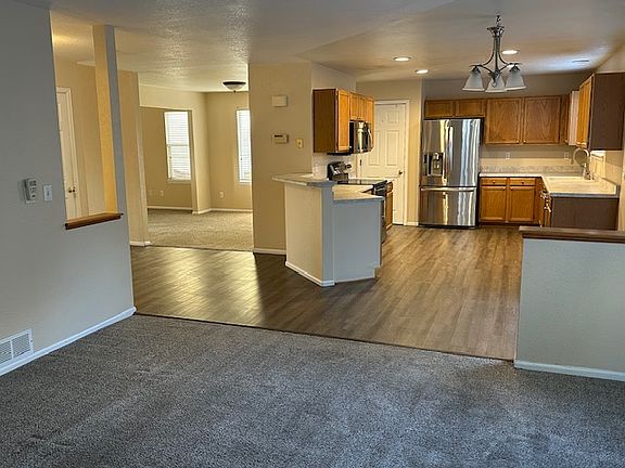 Huge eat-in kitchen, upgraded appliances, dining room off the kitchen. Picture taken from family room with gas fireplace.