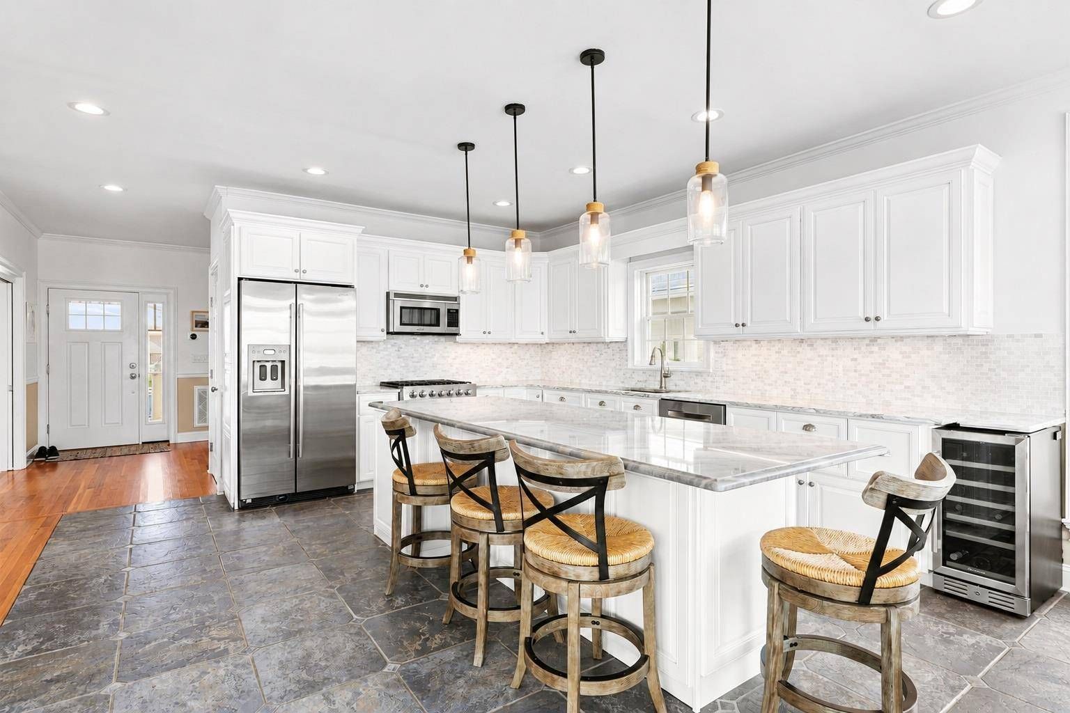  Chefs kitchen with oversized granite kitchen island with high end stainless 