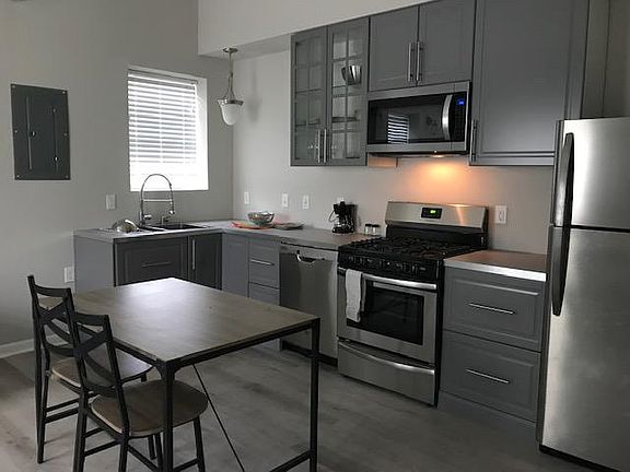 Kitchen, with microwave, gas stove, dishwasher full size fridge with icemaker. Pots and pans and dishes included.