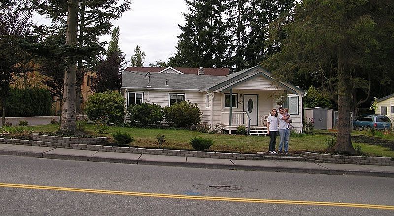 House has been painted and we added a small retaining wall along the sidewalk.
