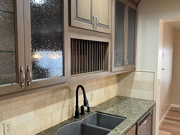 Custom cabinetry in the kitchen showcases your flatware.