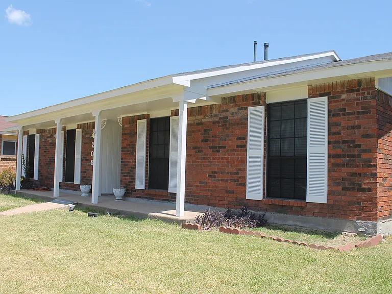 Black window screens add an extra layer of privacy while helping block the Texas heat