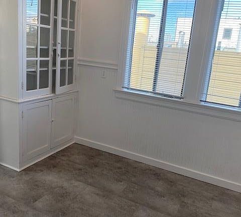 Built in cabinetry/ Hutch in kitchen. Light and Bright with recessed lighting.