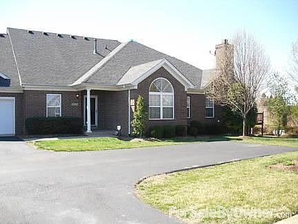 Front with covered porch.