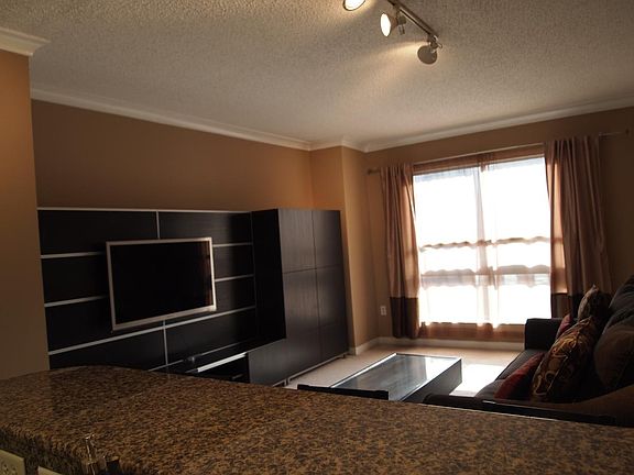 Large TV unit with doors and drawers for storage