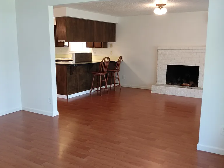 Looking from living room into family room and breakfast bar