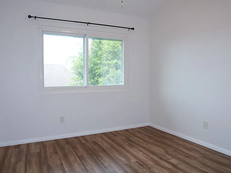 Bedroom #2 with vaulted ceilings.