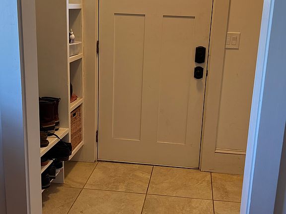 Mudroom / entryway with built in storage, just off the kitchen.